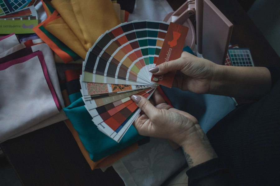Neutral clothing colors arranged to demonstrate stylish outfit combinations