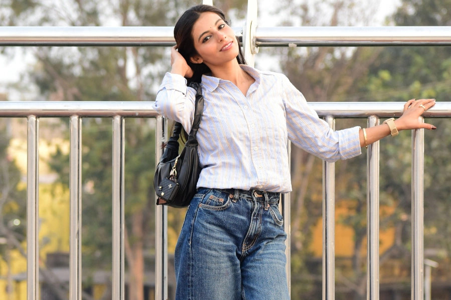 Woman wearing oversized linen shirt with denim