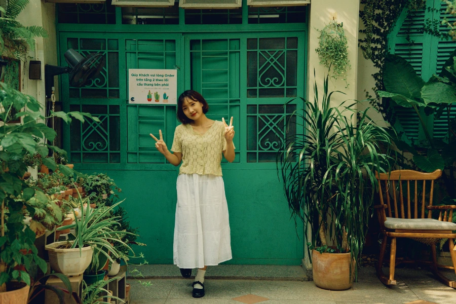 Woman wearing a midi skirt with a basic tank top during summer
